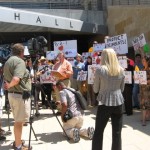 Former Travis County Judge, Bill Aleshire, with Austinites for Geographic Representation outside City Hall.